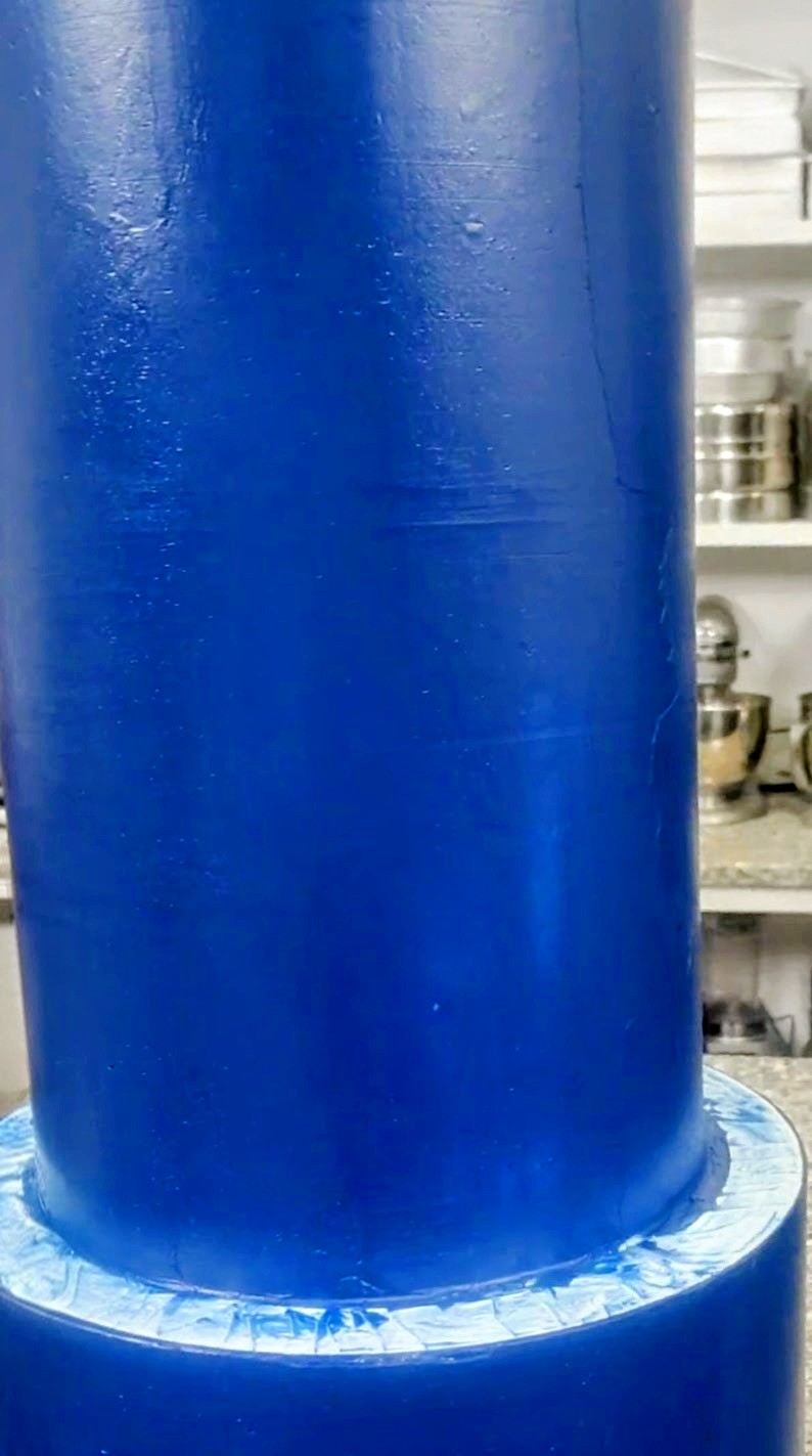 Close-up view of smooth buttercream against the frosting ring